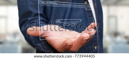 Businessman on blurred background holding and touching a website page sketch