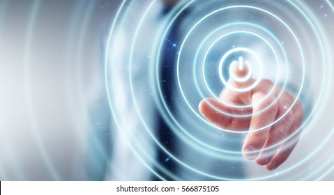 Businessman On Blurred Background Pushing  Power Button With His Finger