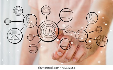 Businessman on blurred background touching hand-drawn graph with contact and connections