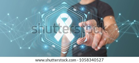 Businessman on blurred background using digital ribbon cancer interface 3D rendering