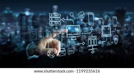 Businessman on blurred background using tech devices and icons thin line interface