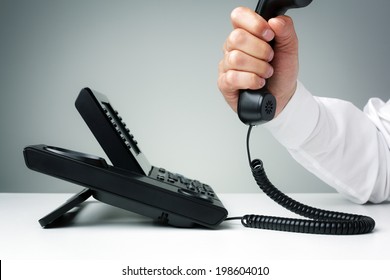 businessman on business landline telephone in an office concept for communication, contact us and customer service support