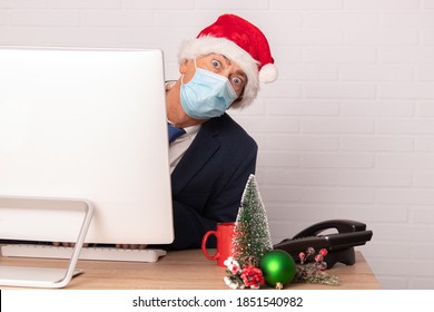 Businessman On Christmas In Office With Face Mask For Coronavirus Pandemic