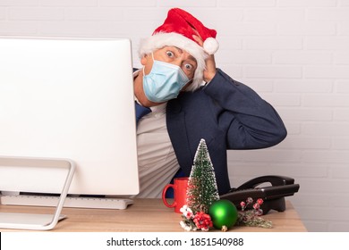 Businessman On Christmas In Office With Face Mask For Coronavirus Pandemic