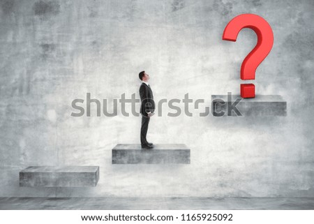 Businessman on concrete ladder looking at question mark. Confusion and solution concept.