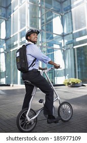 Businessman On Folding Bike