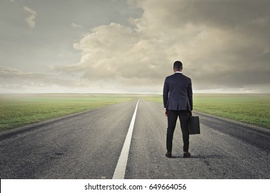 Businessman On A Long Solitary Road
