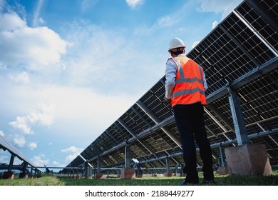 Businessman on a tour of solar power plants to check the operation of the power generation system. solar panels are an alternative electricity source to be sustainable resources in the future. - Shutterstock ID 2188449277
