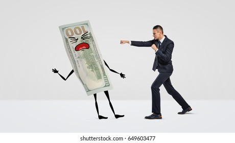 A businessman on white background boxing with a large money bill with arms, legs and a face. Fight over prices. Lower costs. Profit margin.