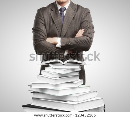 Businessman and open books  on white background