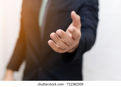 Businessman open hand holding something - Shutterstock ID 712382509