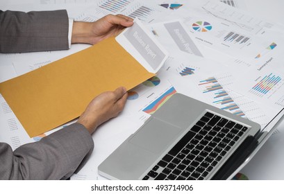 Businessman Opening Business Report Document In Letter Envelope - Business Concept