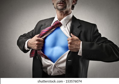 Businessman Opens Shirt And Shows Superhero Suit