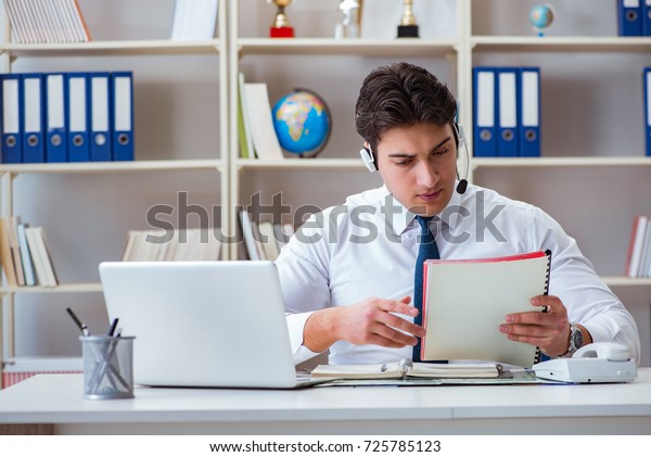Businessman operator traveling agent working in\
the office