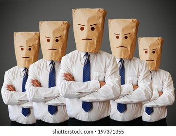 Businessman with a paper bag with angry face on it