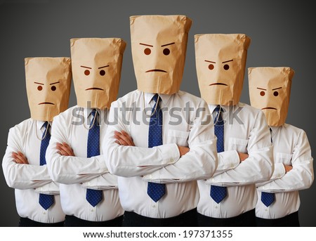 Businessman with a paper bag with angry face on it