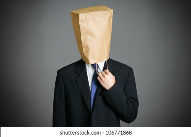 Businessman with a paper bag  on head