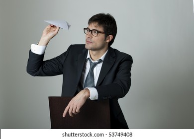 Businessman With Paper Plane