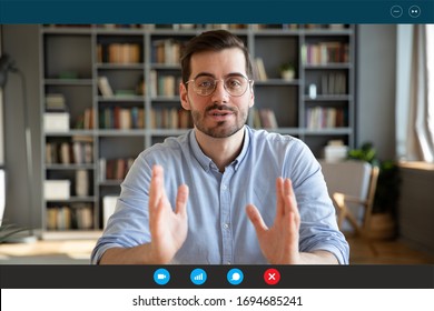 Businessman participate at virtual distant negotiations with colleagues via teleconference. Talk with clients provide information strategizing remotely. Video call self-isolation during ncov situation - Shutterstock ID 1694685241