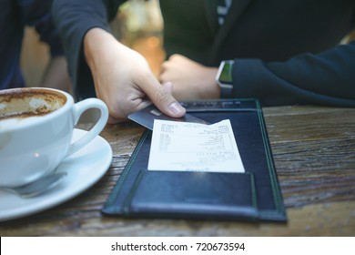 A Businessman Is Paying His Bill By Credit Card At The Restaurant.