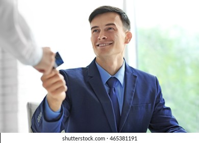 Businessman Paying Restaurant Bill With Credit Card