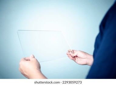 businessman, people and technology concept - close up of hands with transparent tablet pc computer - Powered by Shutterstock