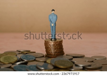 The businessman, perched on a pile of coins, gazed backward, drawing wisdom from past experiences, contemplating the journey that led him to his current success.