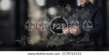 A businessman performs an operation p2p on a virtual computer and a mobile device.