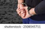 Businessman person hands in handcuffs arrested