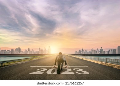 businessman person ready to run 2023 toward the city. Business start-up concept. - Shutterstock ID 2176162257