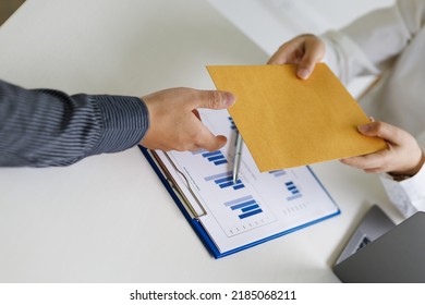 Businessman picking up and delivering documents in the office. - Shutterstock ID 2185068211