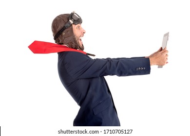 Businessman with pilot goggles and tablet isolated in white - Powered by Shutterstock