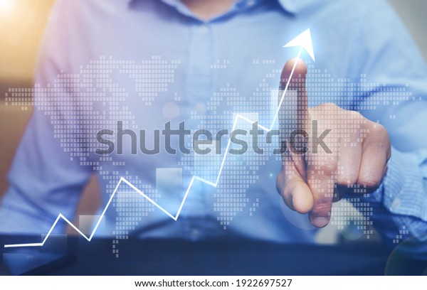Businessman pointing arrow graph growing\
corporate on world map background. Development  to success and\
growing growth international \
business.