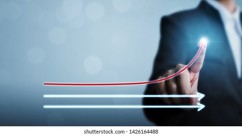 Businessman pointing arrow moving up growing business growth. Concept of corporate success, influencer, opinion leader, benchmark and think different
