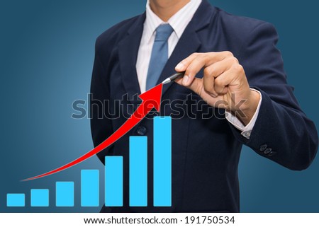 businessman pointing to bargraph 