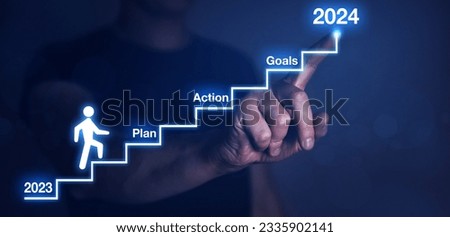 Businessman pointing to the growing plan of successful business in 2024 year and a figure climbs the ladder of success. Year 2024 plan, action and goals.