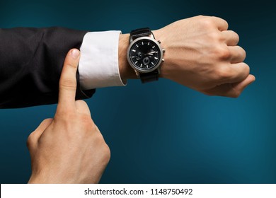 Businessman Pointing At Hand Watch