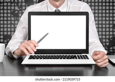 Businessman Pointing On Blank Laptop Scree. Trade And Finance Concept. Close Up