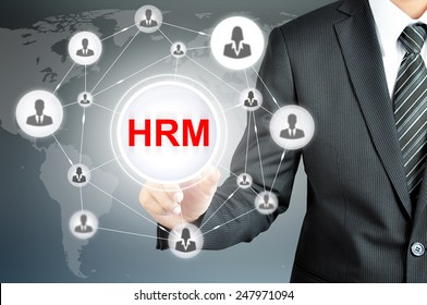 Businessman Pointing On HRM (Human Resource Management ) Sign On Virtual Screen With People Icons Linked As Network