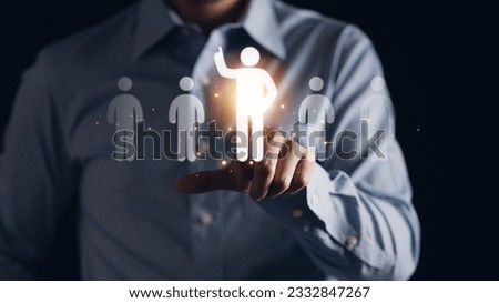 Businessman pointing to a raise hand man icon, representing HR management and the concept of talent acquisition and workforce development. Human resources for business success