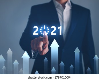 Businessman pointing START future button of year 2021. Development to success and growth concept. 