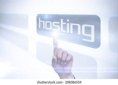 Businessman Pointing To Word Hosting Against White Background With Vignette