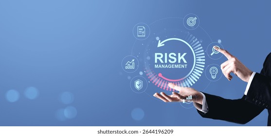 Businessman points at digital risk management interface with business icons, futuristic style on gradient blue background, concept of investment protection