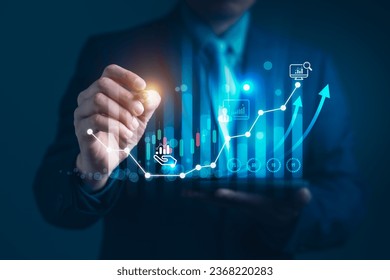 Businessman points a graph depicting the growth of business, data analysis in shaping a thriving global enterprise of blockchain technology and strategic planning in the modern business - Powered by Shutterstock