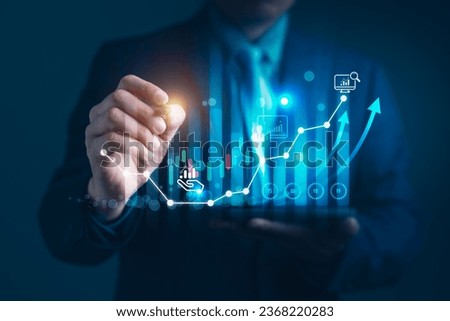 Businessman points a graph depicting the growth of business, data analysis in shaping a thriving global enterprise of blockchain technology and strategic planning in the modern business
