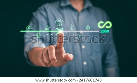 Businessman points to an increasing arrow symbolizing carbon reduction. Emphasizes the importance of limiting global warming and CO2 emissions in the bio circular green economy. Stock photo © 