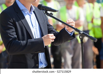 Businessman or politician is giving a speech - Shutterstock ID 527115829