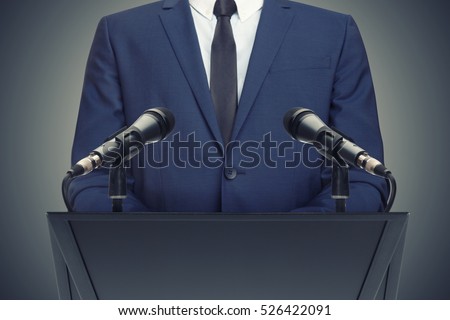 Businessman or politician making speech from behind the pulpit