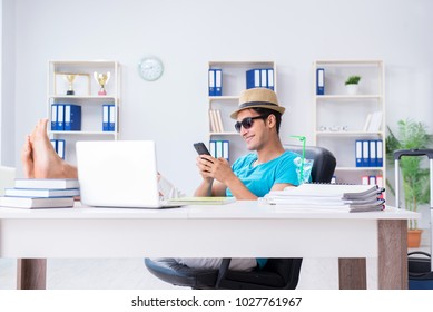 Businessman Preparing For Vacation In The Office