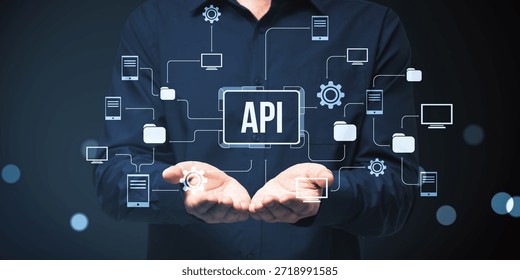 Businessman presenting API interface with connected icons representing software, app, and online network structure on abstract dark background